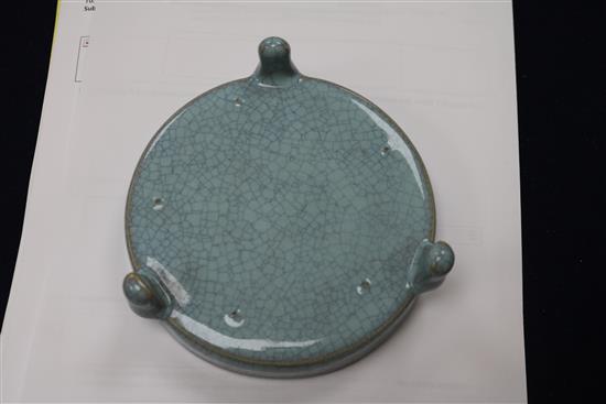 A Chinese celadon glazed dish, a Jun type tripod dish and a famille rose bowl and cover